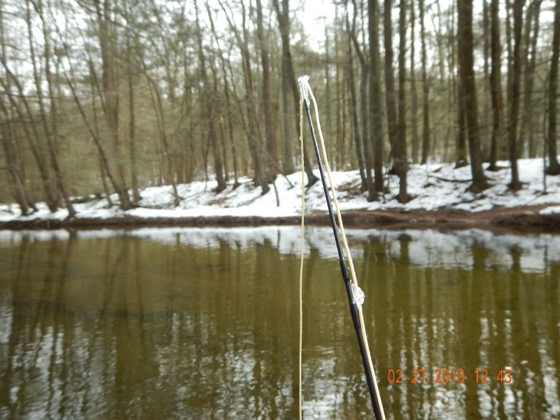 $Clarks19a002$.jpg - This SUCKS! Thought I left this kind of fishing in New York.  Ice in the line guides and on the line. The weather man lies, he said a high of 39 deg today.