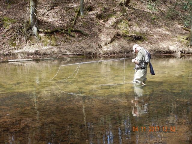 DSCN1890.jpg - Changing flies.  We've tried all of the top water stuff and were only moderately successful.  Time to go under.                               