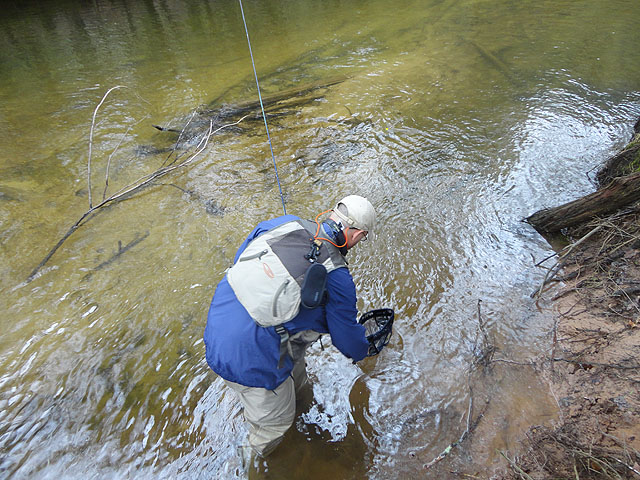 DSC01453.jpg -                                Here he is releasing his fish.