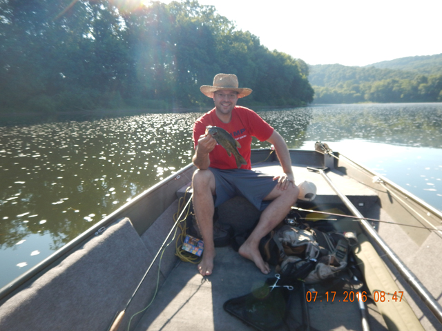 DSCN1544.jpg -                                Hey, nice river hat.  It actually looks pretty good!  BTW, so does the fish.