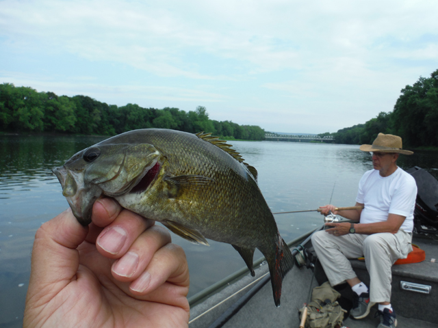 DSCF9431.jpg - Two old guys, a flat bottom boat and a couple bass...really, it doesn't get much better than this.