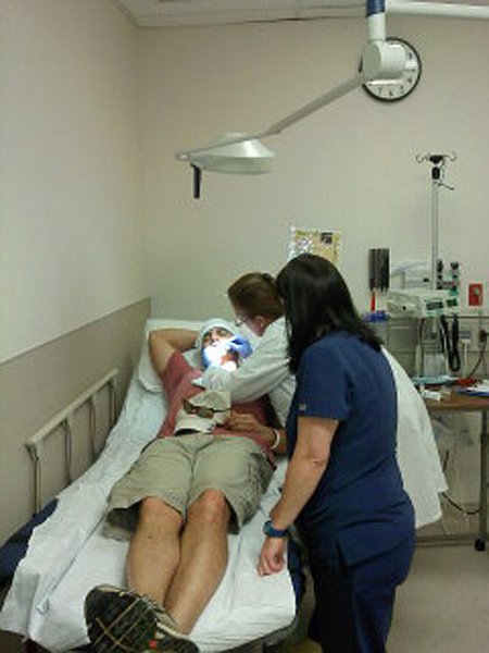 0609121415.jpg - Doc took about 30 minutes or so to get the hook removed but she did so without using any stiches.  Excellent job.  Hummm....where's the pretty girl from the admissions office????