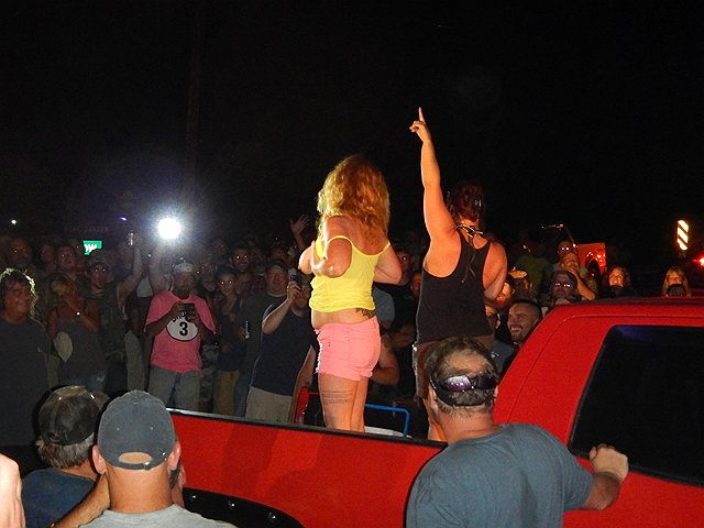 DSCN0251.jpg -                                And the crowd grew witht he usual party highlights from the back of a pickup truck.
