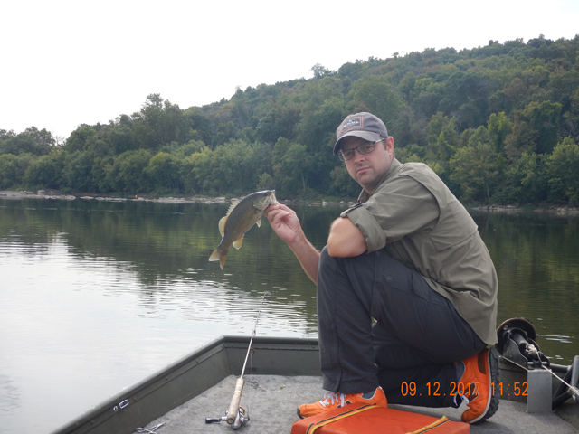 DSCN2578.jpg -                                Kinda looking cocky isn't he? I hadn't so much as hooked a fish let along touch one.