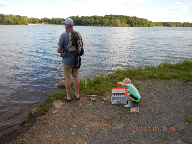 DSCN2138.jpg - We did have a little help catching fish.  The little one was looking for lures that would work in his tackle box.                               
